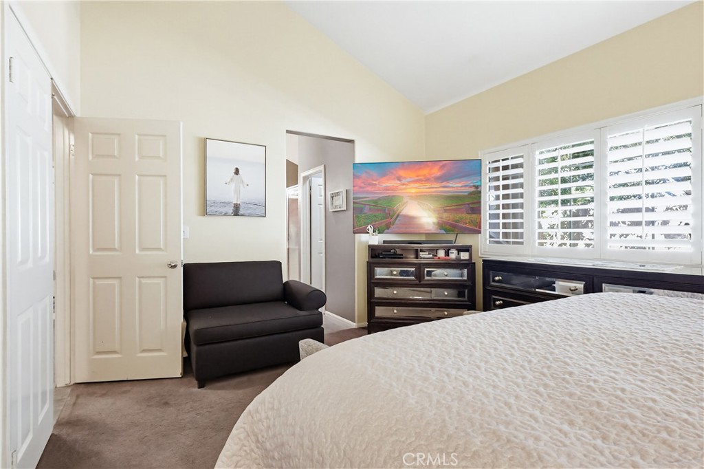 7735 Ridgeview Lane Whittier, CA 90606 - Photo 31 of 47 a bedroom with a bed a television and a couch
