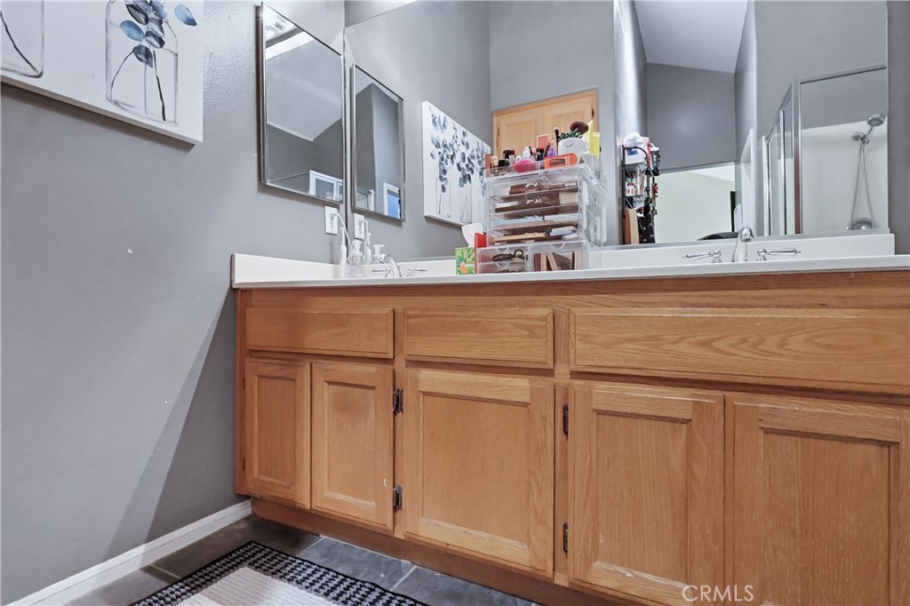 7735 Ridgeview Lane Whittier, CA 90606 - Photo 35 of 47 a bathroom with a sink and a mirror