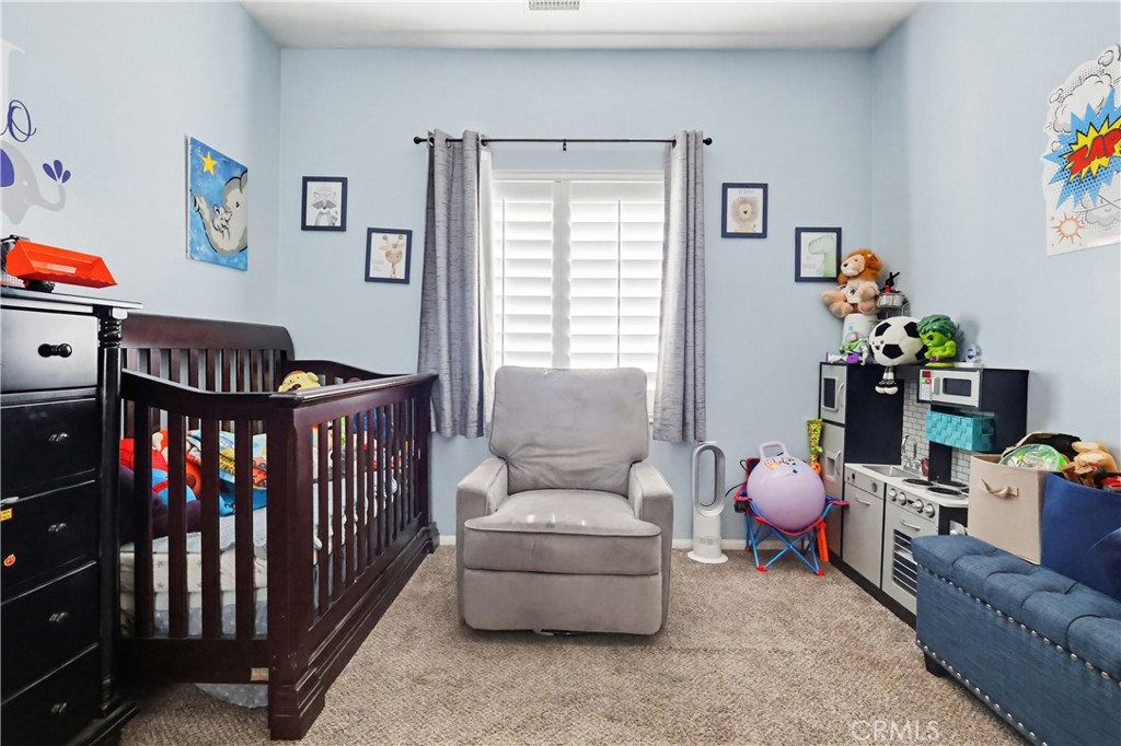 7735 Ridgeview Lane Whittier, CA 90606 - Photo 37 of 47 a bedroom with furniture and a window