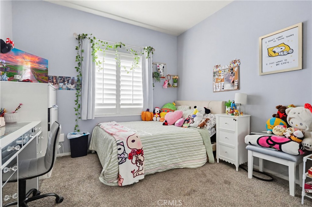 7735 Ridgeview Lane Whittier, CA 90606 - Photo 39 of 47 a bedroom with a bed and a table