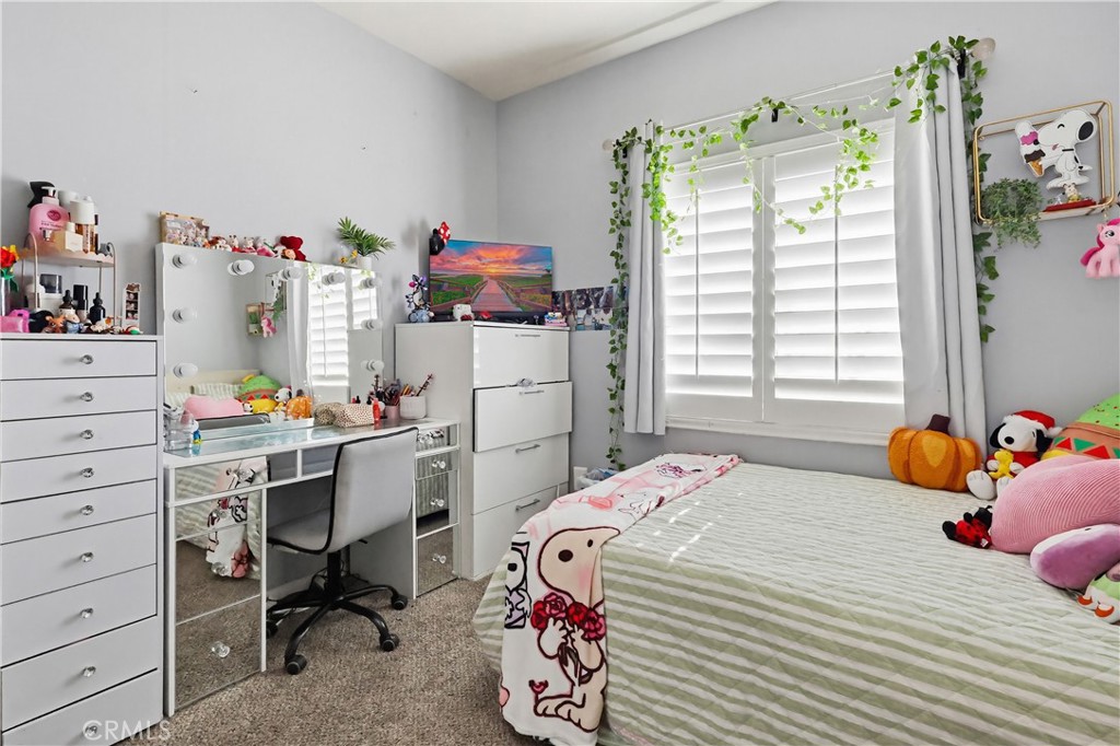 7735 Ridgeview Lane Whittier, CA 90606 - Photo 40 of 47 a bedroom with a bed and a window