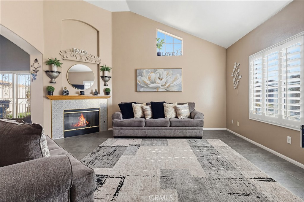 7735 Ridgeview Lane Whittier, CA 90606 - Photo 4 of 47 a living room with furniture and a fireplace