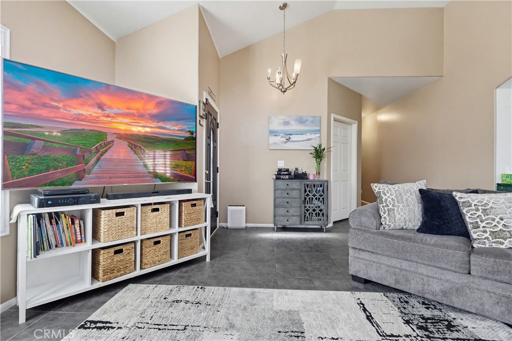 7735 Ridgeview Lane Whittier, CA 90606 - Photo 6 of 47 a living room with furniture and a flat screen tv