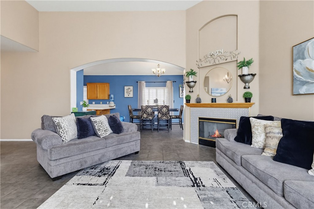 7735 Ridgeview Lane Whittier, CA 90606 - Photo 7 of 47 a living room with furniture and a fireplace