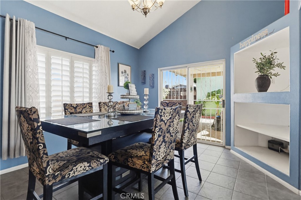 7735 Ridgeview Lane Whittier, CA 90606 - Photo 10 of 47 a view of a dining room with furniture and chandelier