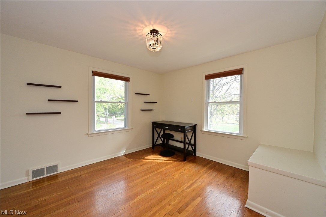3798 Hillbrook Road Cleveland, OH 44118 - Photo 22 of 34 Wood floored spare room with a wealth of natural light