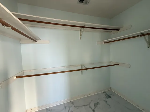 a view of a room with racks on the wall