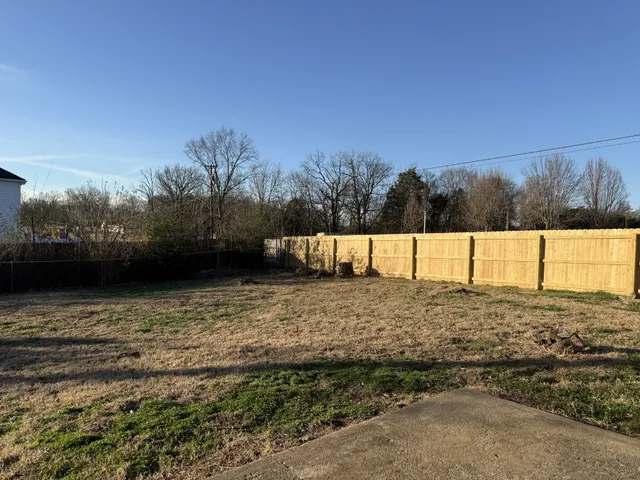 a view of a road with a yard