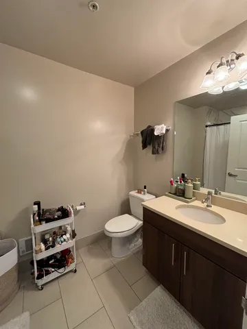 a bathroom with a double vanity sink and a mirror