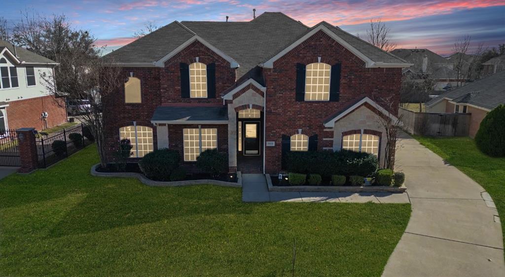 2831 Kate Lane Grand Prairie, TX 75052 - Photo 1 of 1 a front view of a house with a yard
