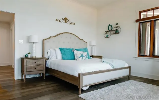 a bathroom with a double vanity sink toilet and shower