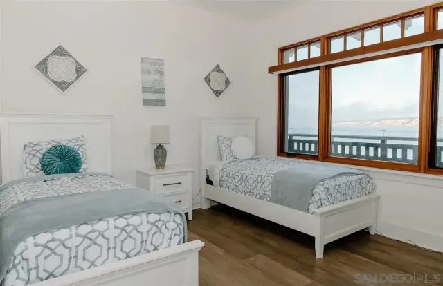 a spacious bathroom with a mirror and a shower