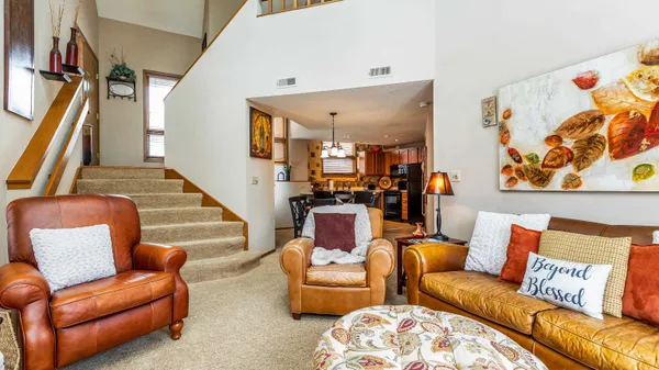a kitchen with stainless steel appliances granite countertop a sink a stove and cabinets