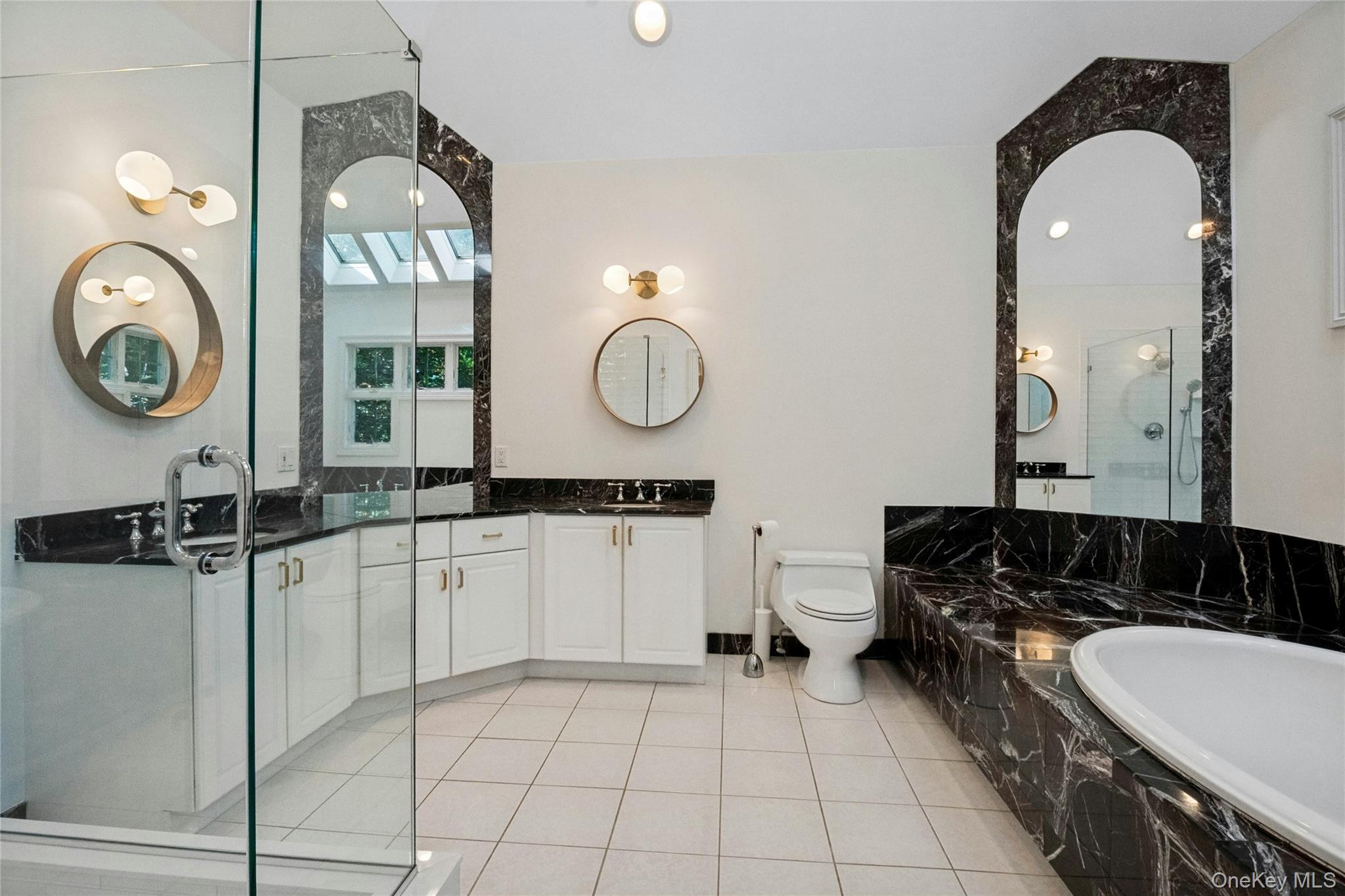 25 Riverview Road Irvington, NY 10533 - Photo 30 of 41 Large walk in shower, dual sinks, soaking tub and skylights complete this spacious bathroom