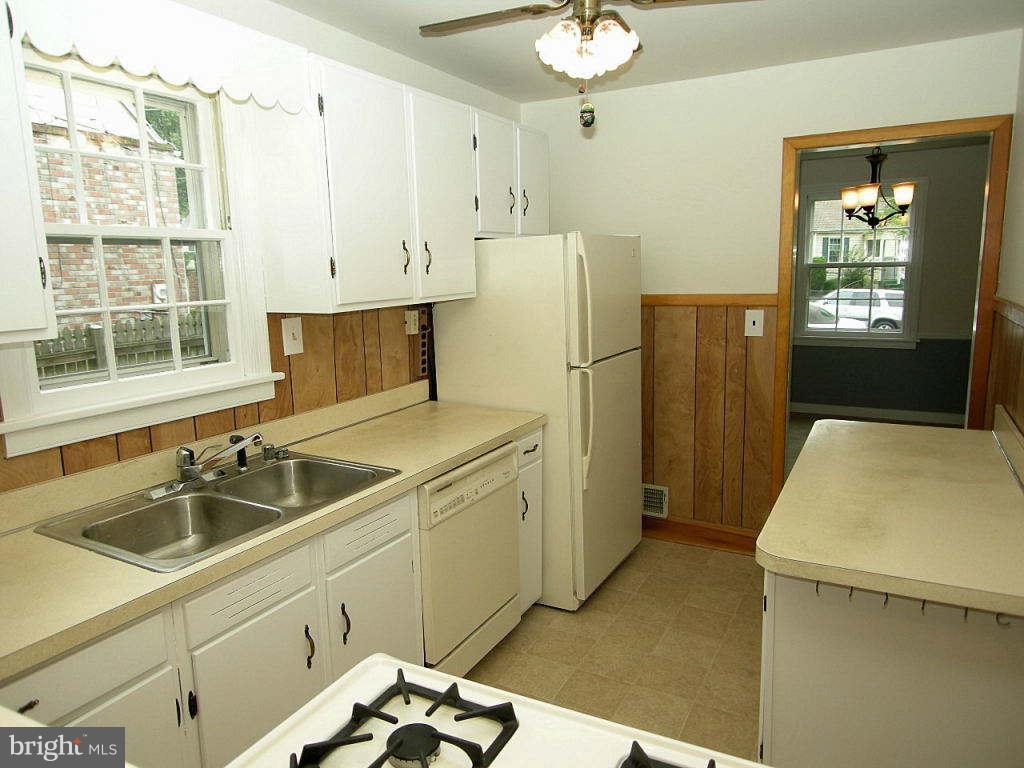 2510 Sheraton Street Silver Spring, MD 20906 - Photo 5 of 21 a kitchen with a sink appliances and cabinets