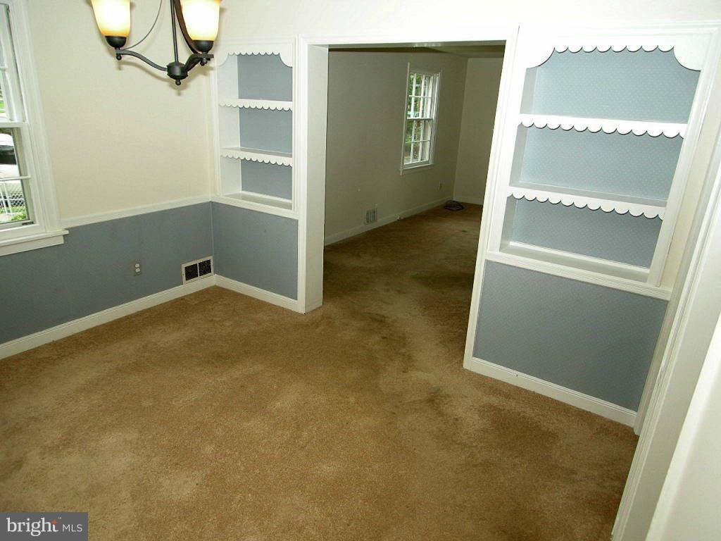 2510 Sheraton Street Silver Spring, MD 20906 - Photo 7 of 21 an empty room with a fireplace