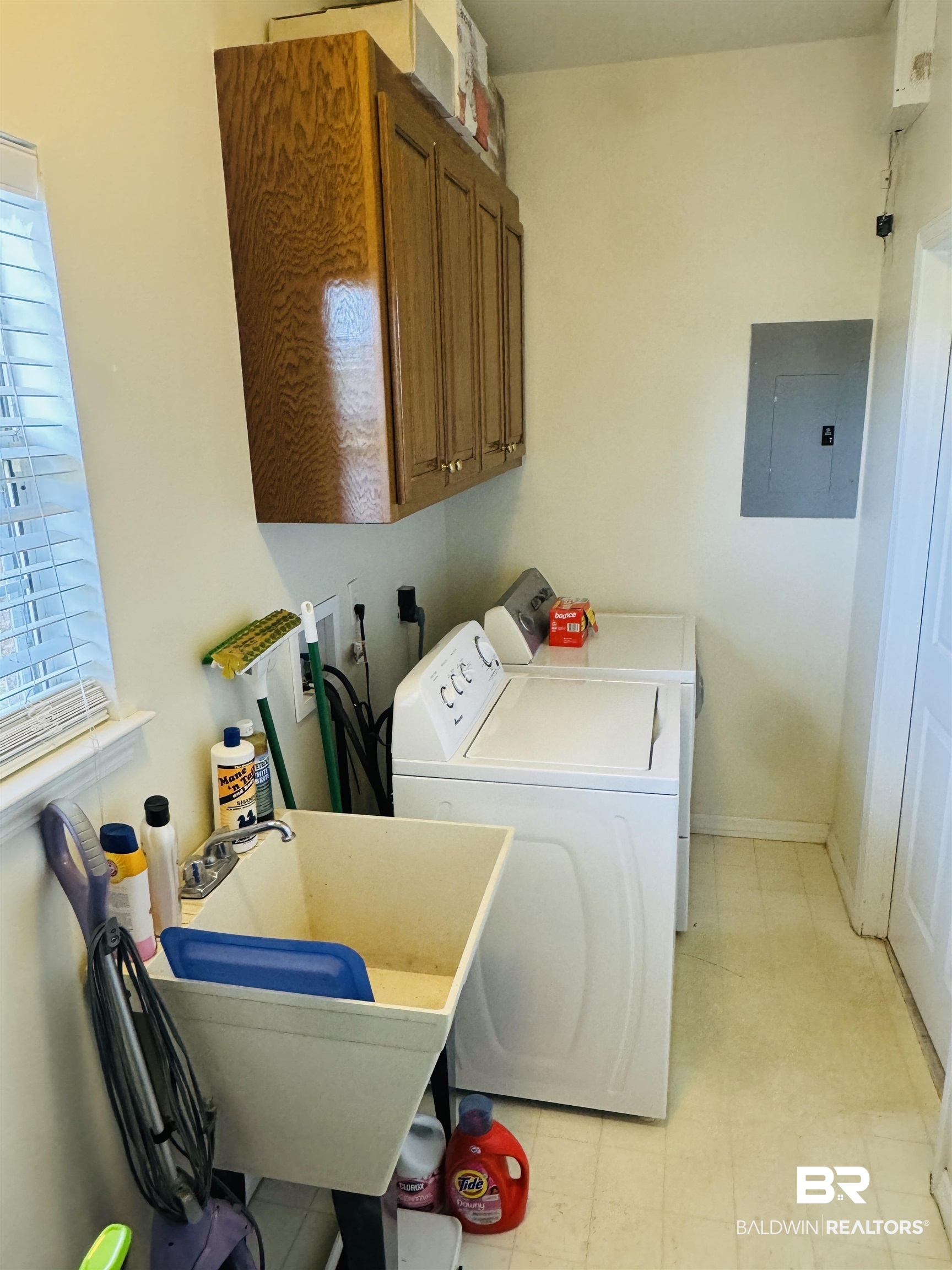 13795 White Road Silverhill, AL 36576 - Photo 36 of 99 Laundry room featuring light floors, electric panel, cabinet space, and washing machine and dryer