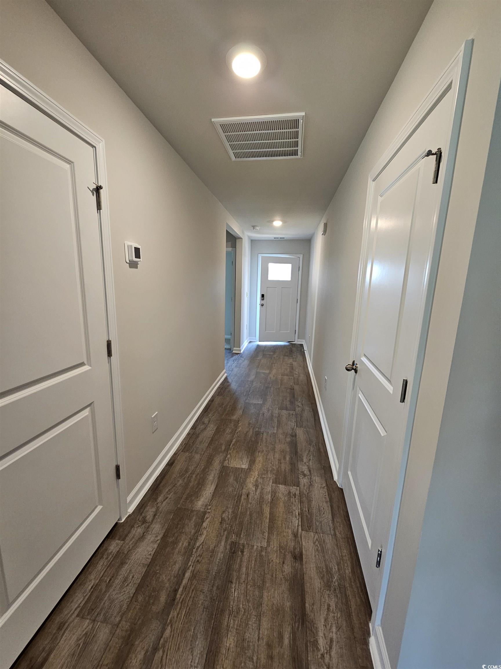 374 Jeff Waters Circle Longs, SC 29568 - Photo 20 of 22 Corridor with dark wood-style flooring and baseboa