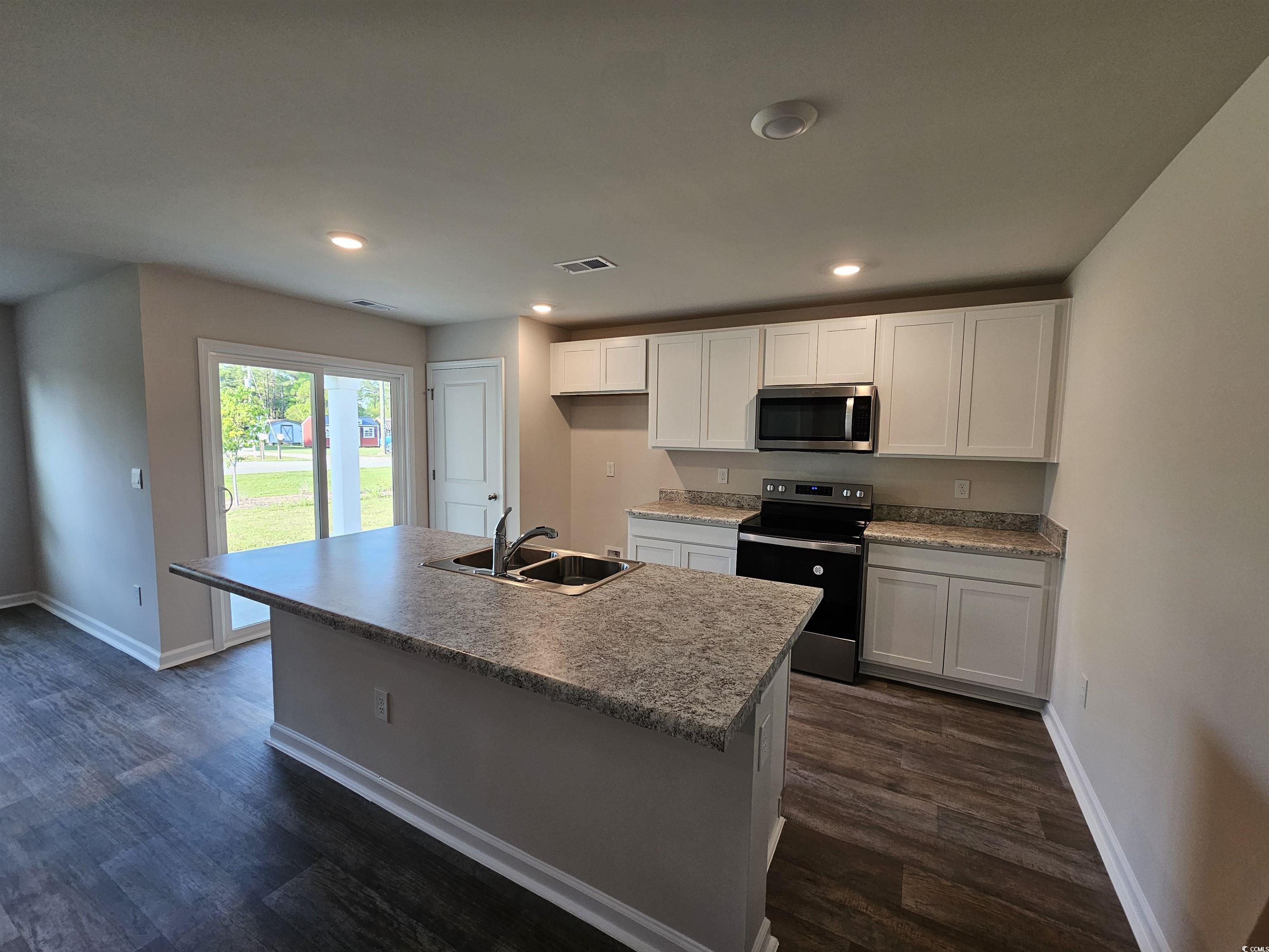 374 Jeff Waters Circle Longs, SC 29568 - Photo 4 of 22 Kitchen with stainless steel microwave, range with