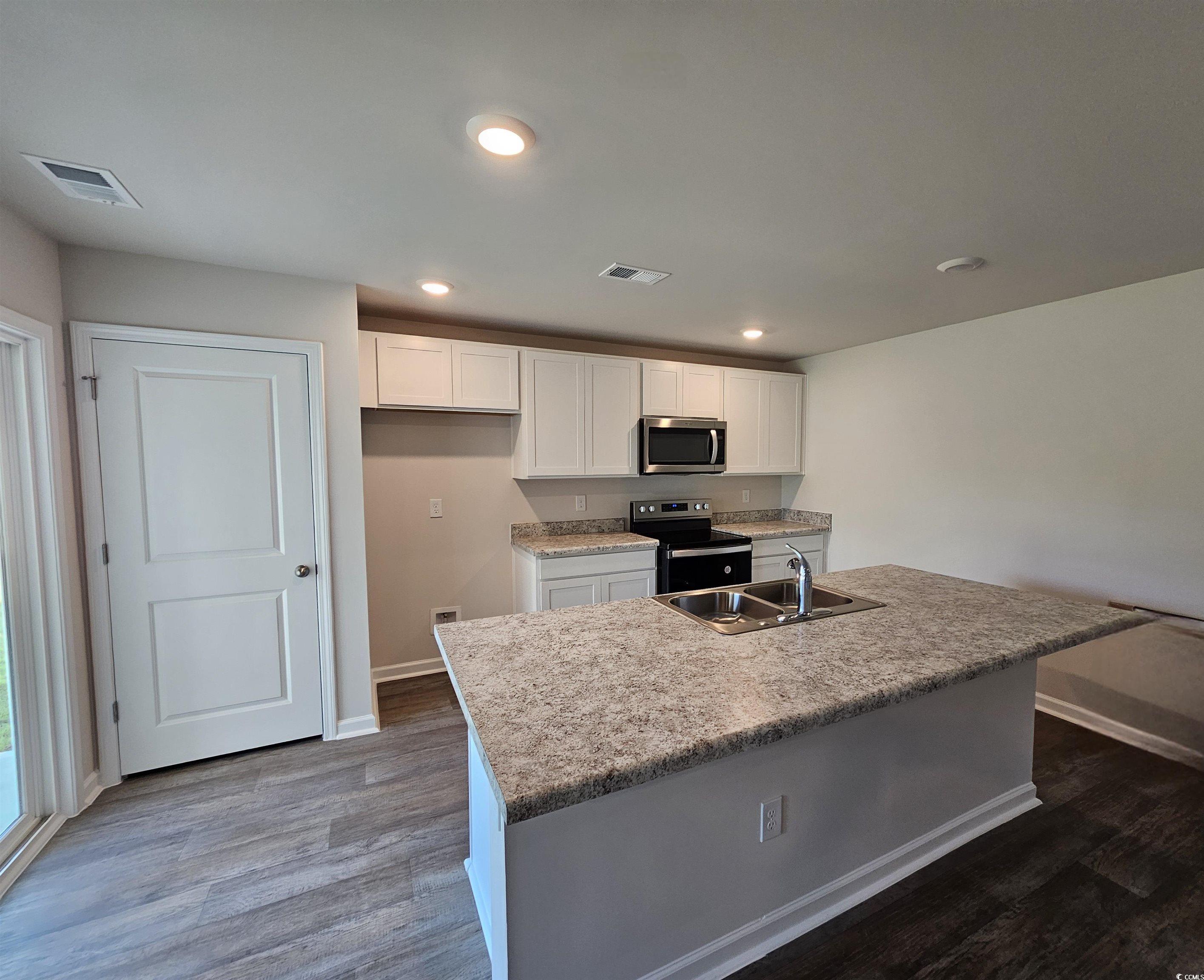 374 Jeff Waters Circle Longs, SC 29568 - Photo 5 of 22 Kitchen with stainless steel appliances, a sink, b