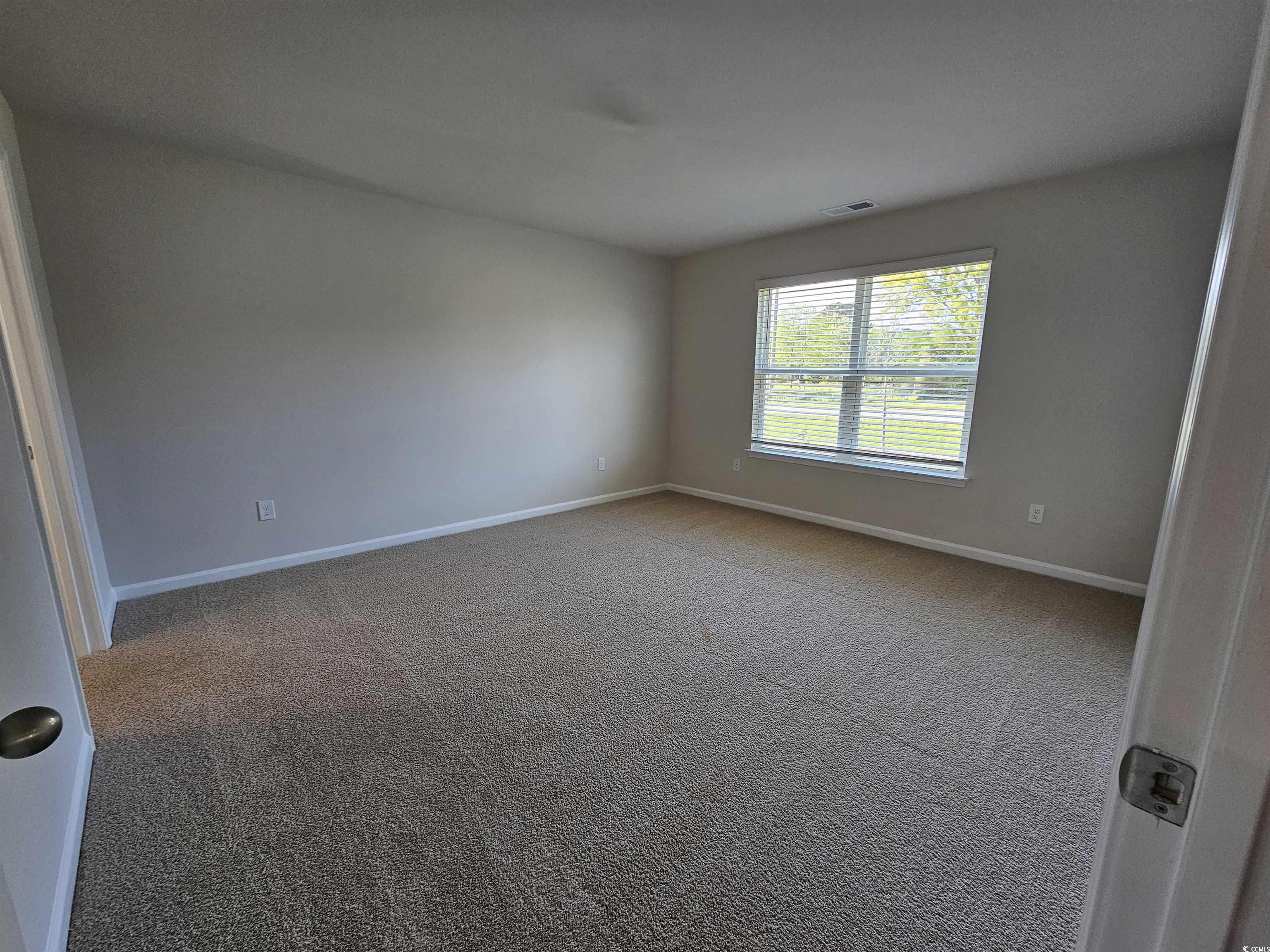 374 Jeff Waters Circle Longs, SC 29568 - Photo 7 of 22 Carpeted empty room with baseboards