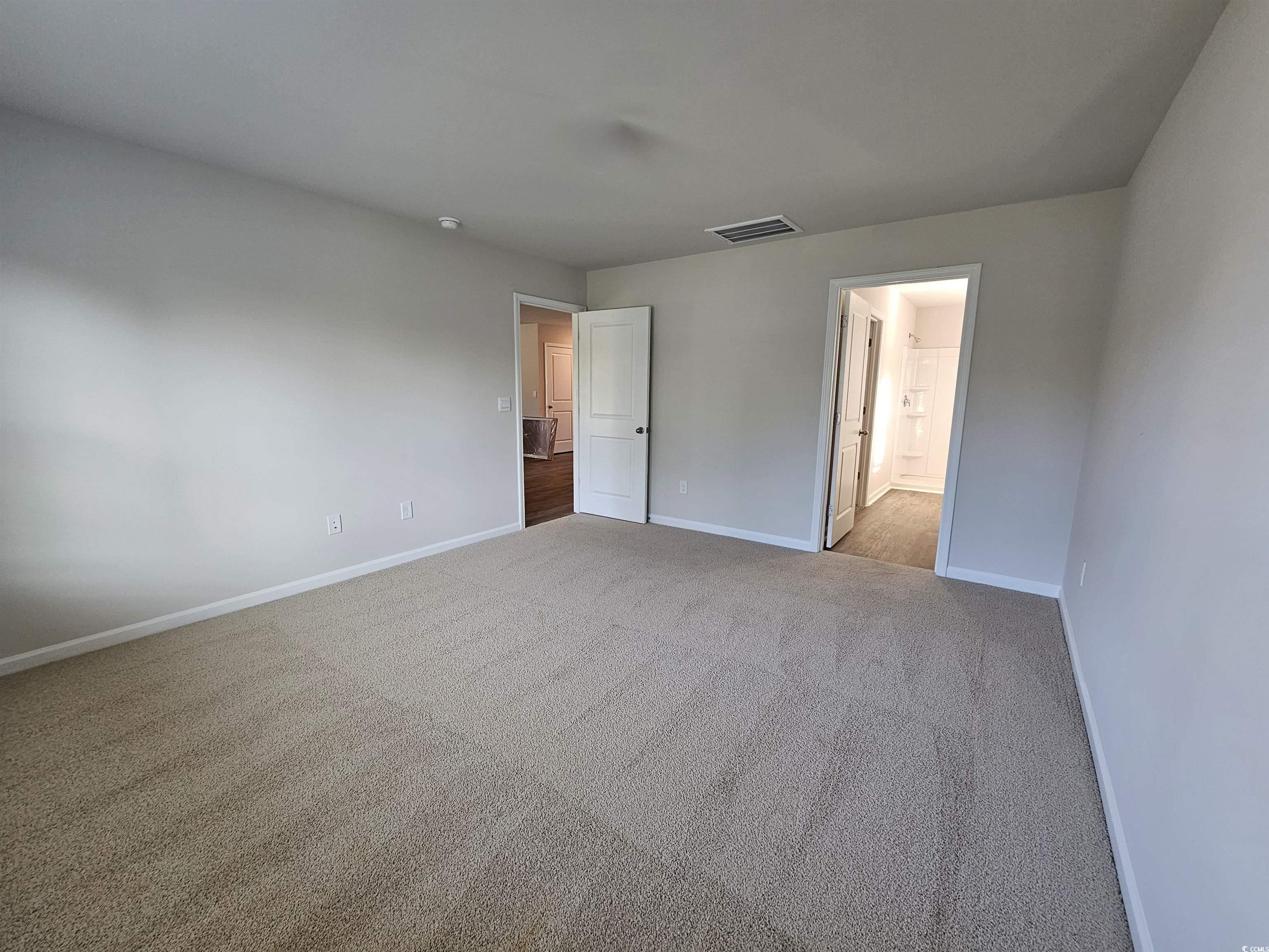 374 Jeff Waters Circle Longs, SC 29568 - Photo 9 of 22 Unfurnished bedroom featuring baseboards, carpet f