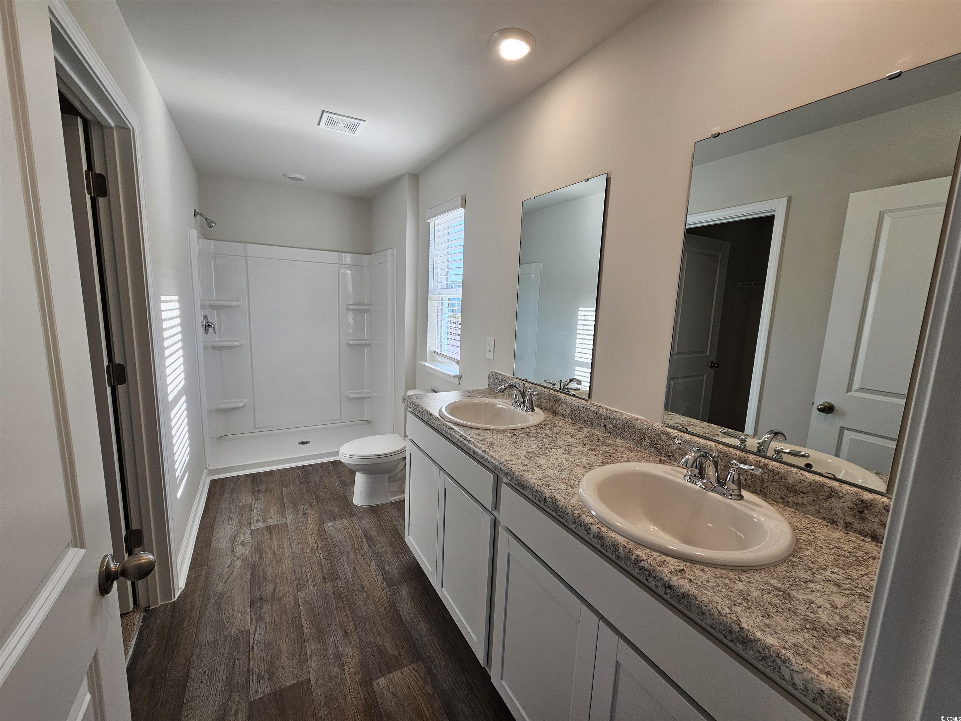 374 Jeff Waters Circle Longs, SC 29568 - Photo 10 of 22 Full bath with walk in shower, wood finished floor