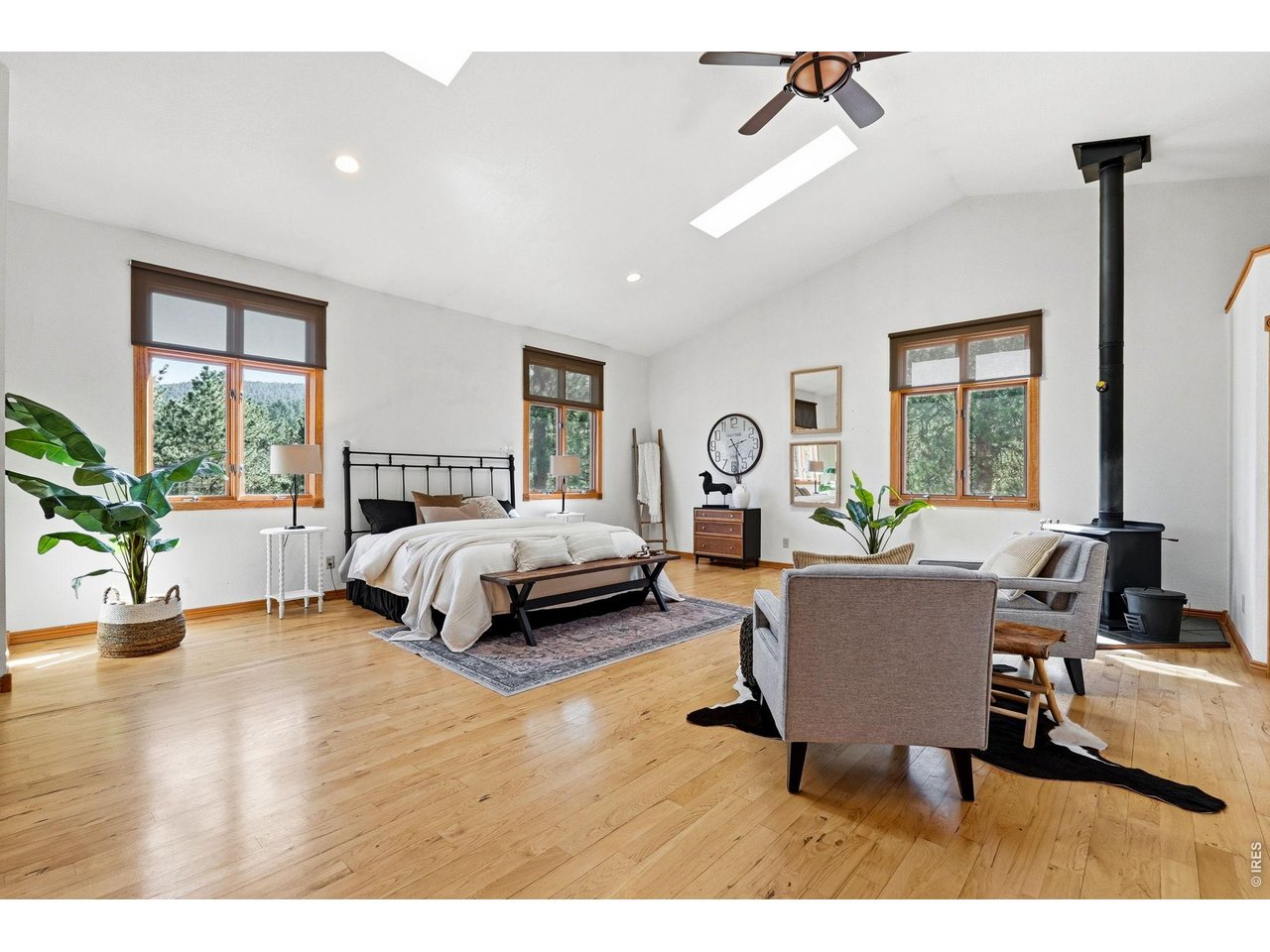 560 Quillan Gulch Road Loveland, CO 80537 - Photo 14 of 49 Spacious Primary with vaulted ceilings and tons of natural light