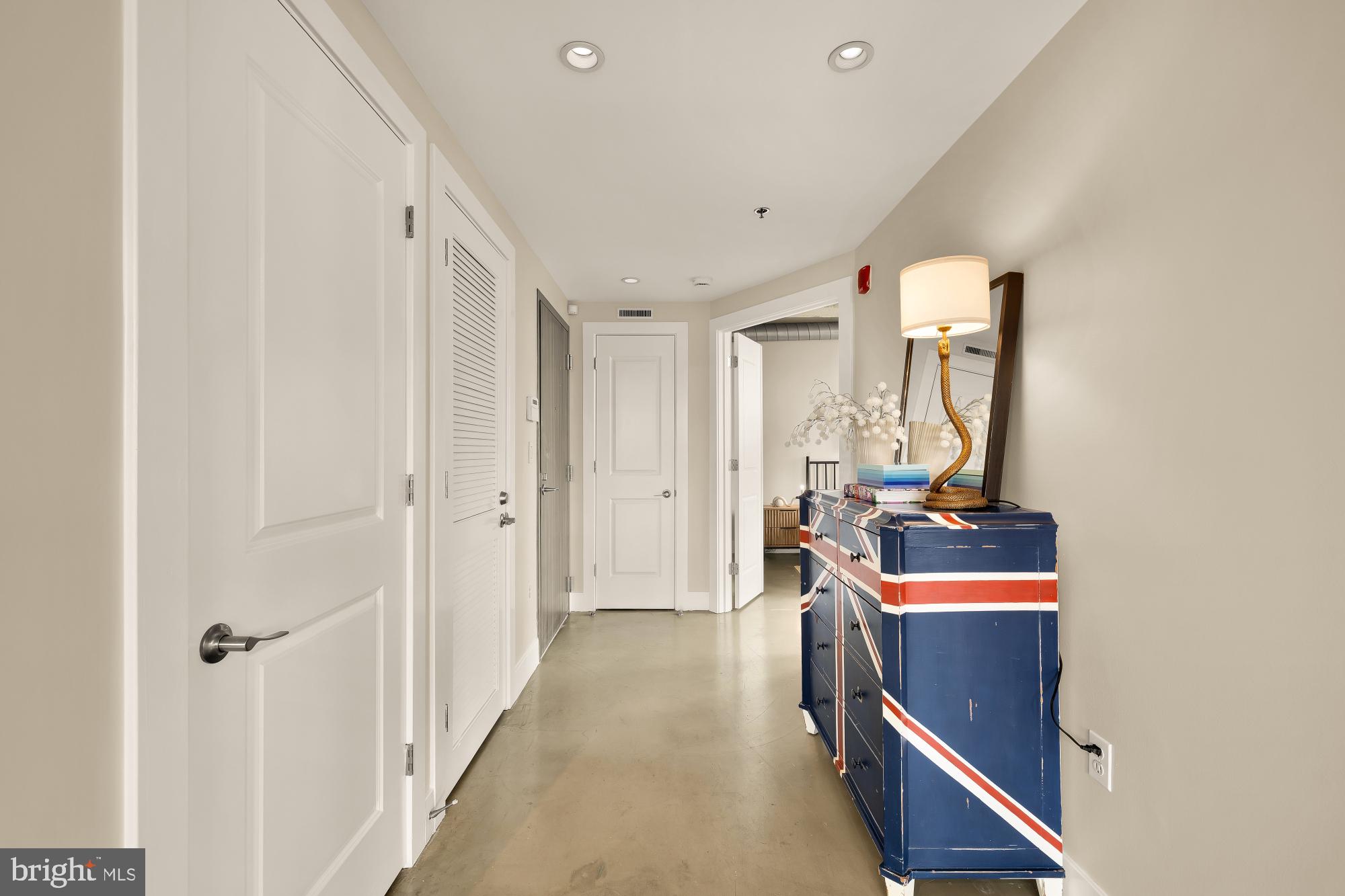 916 G St. Northwest, Unit 806 Washington, DC 20001 - Photo 11 of 19 a view of a hallway with workspace and a window