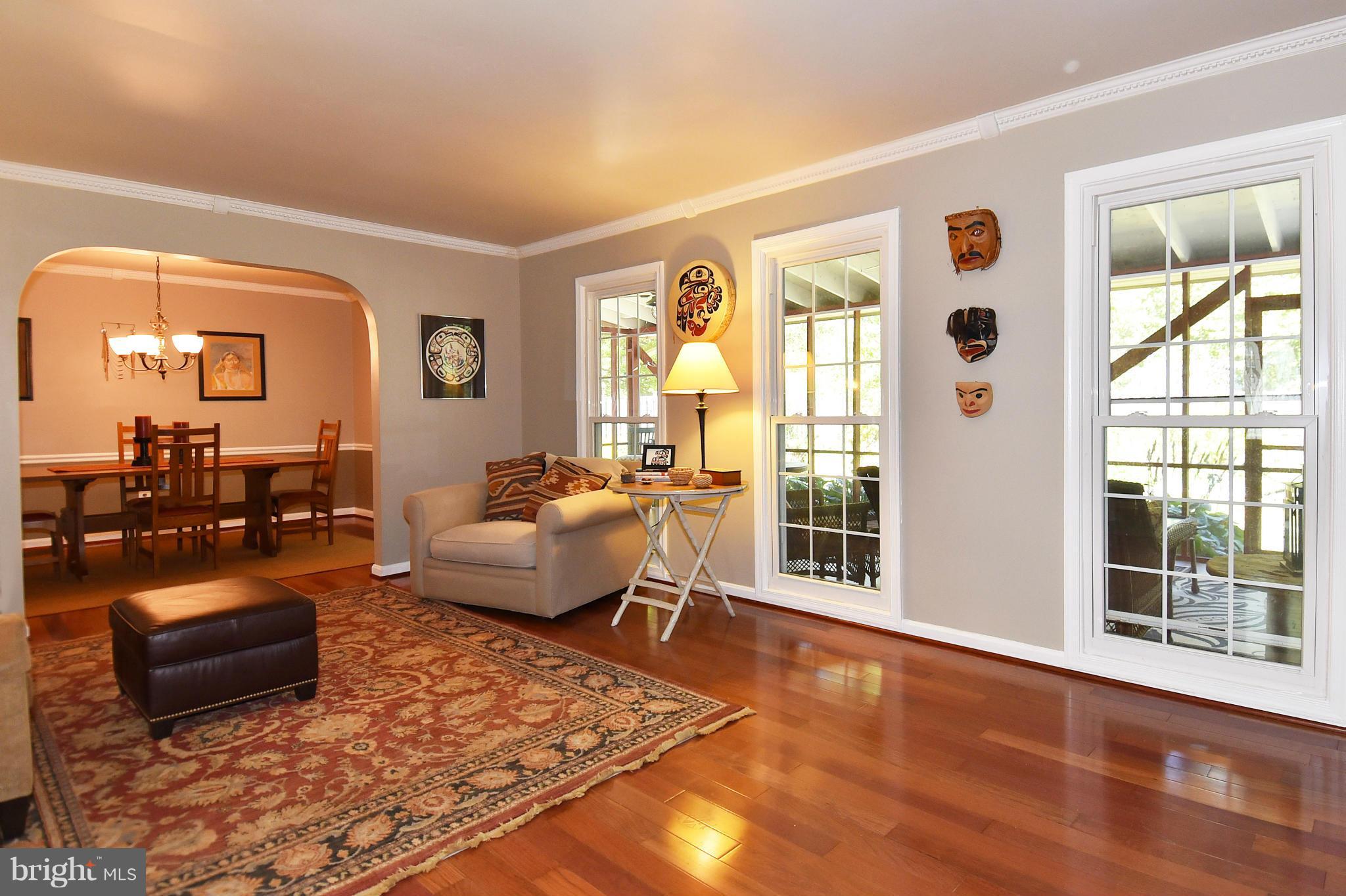 2116 Countryside Drive Silver Spring, MD 20905 - Photo 12 of 30 Living room opens to large screened porch
