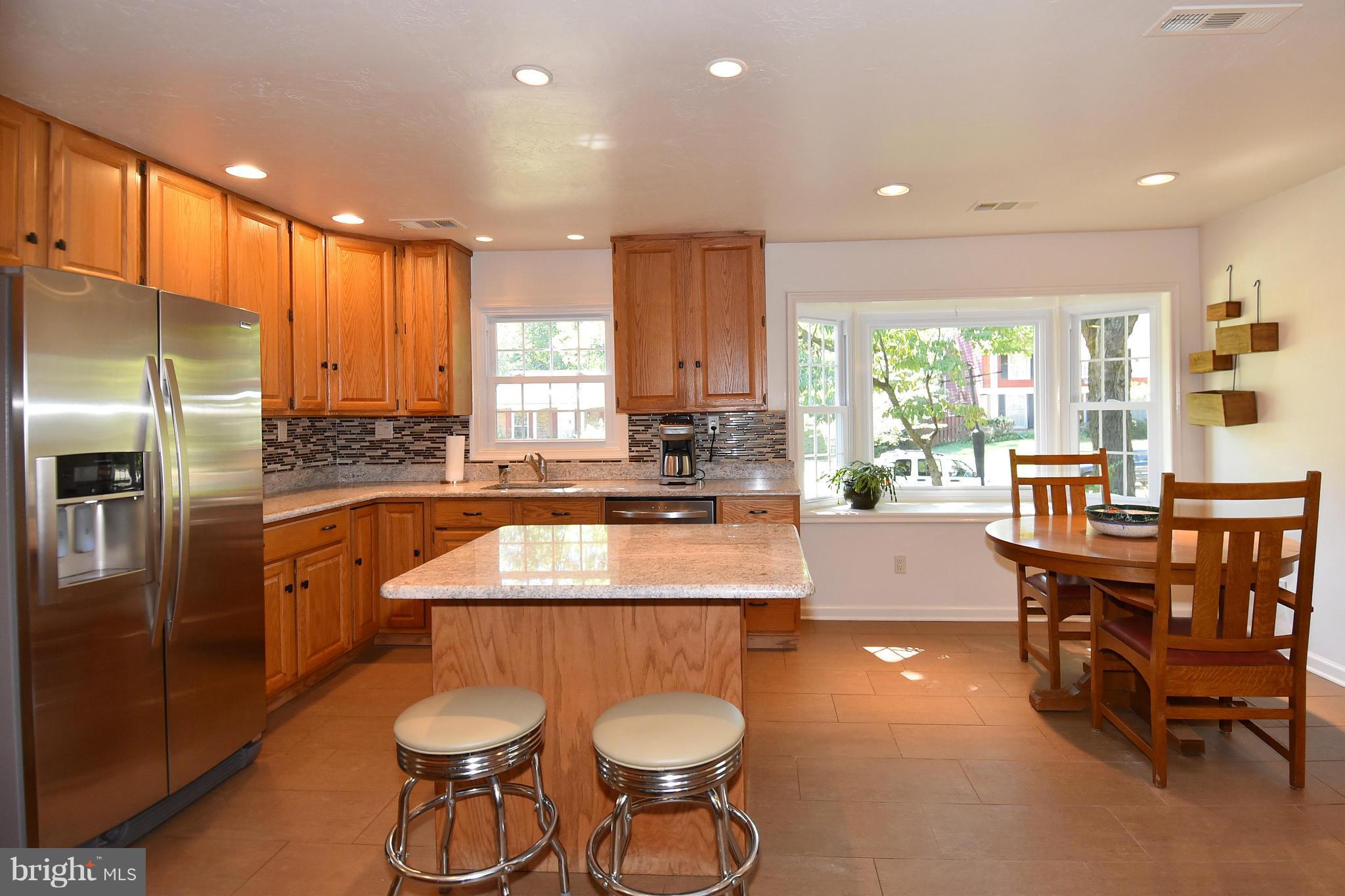 2116 Countryside Drive Silver Spring, MD 20905 - Photo 5 of 30 Kitchen island and room for a table, too