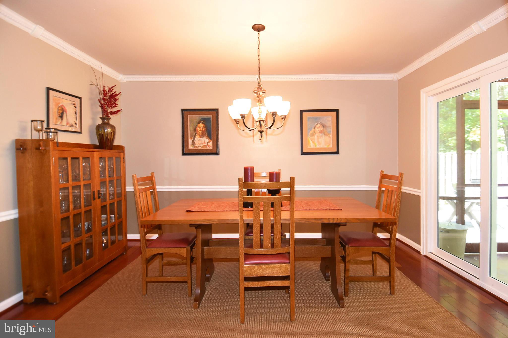 2116 Countryside Drive Silver Spring, MD 20905 - Photo 8 of 30 Dining rooms opens to screened porch