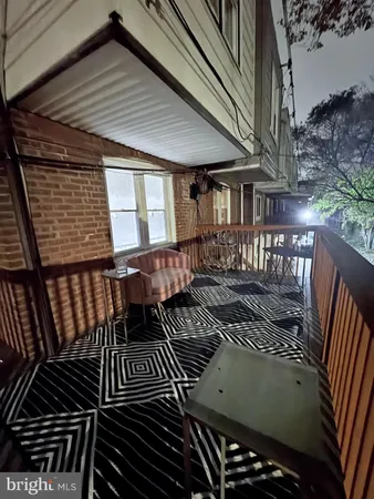 a view of a patio with wooden floor