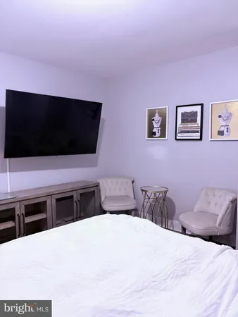 a view of a livingroom with wooden floor and closet