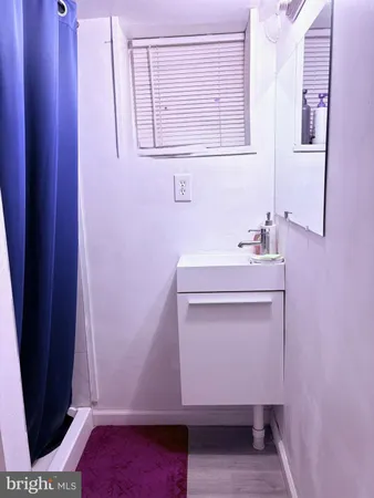 a bathroom with a sink and toilet