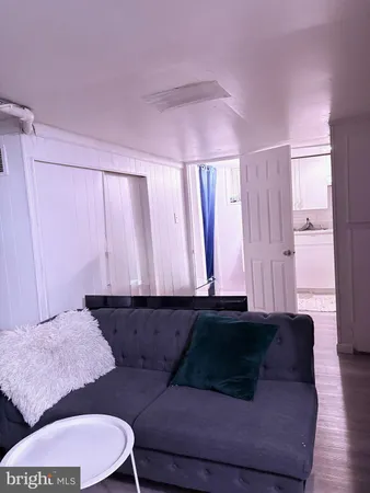 a utility room with furniture and a fireplace