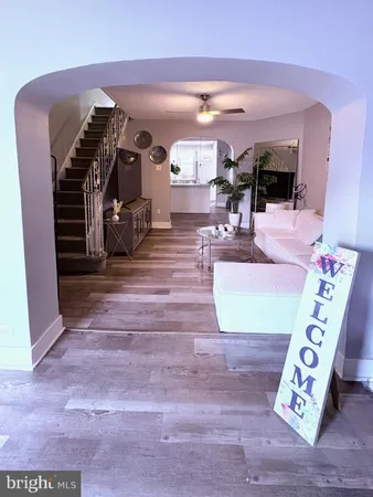 a view of living room with furniture and wooden floor