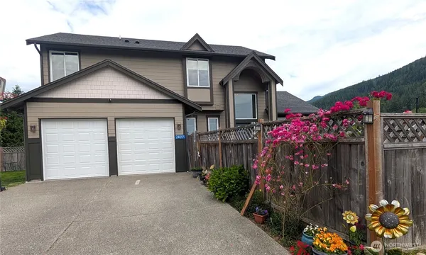 a front view of a house with a garage