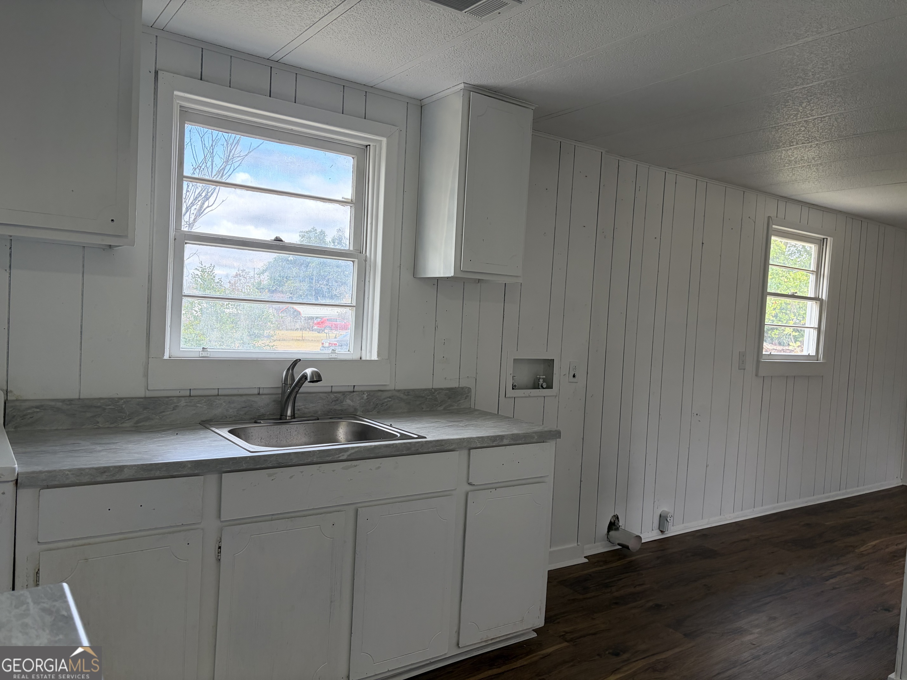 184 Belvue Avenue Lyons, GA 30436 - Photo 6 of 11 a kitchen with sink cabinets and window