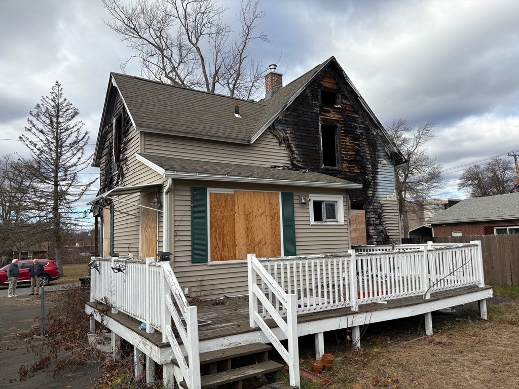 15 Hudson Avenue Chicopee, MA 01020 - Photo 3 of 7 a view of a house with a wooden bench