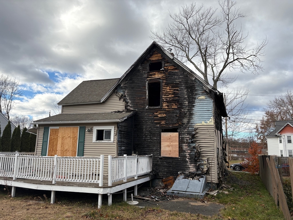 15 Hudson Avenue Chicopee, MA 01020 - Photo 6 of 7 a front view of a house with entryway and fence