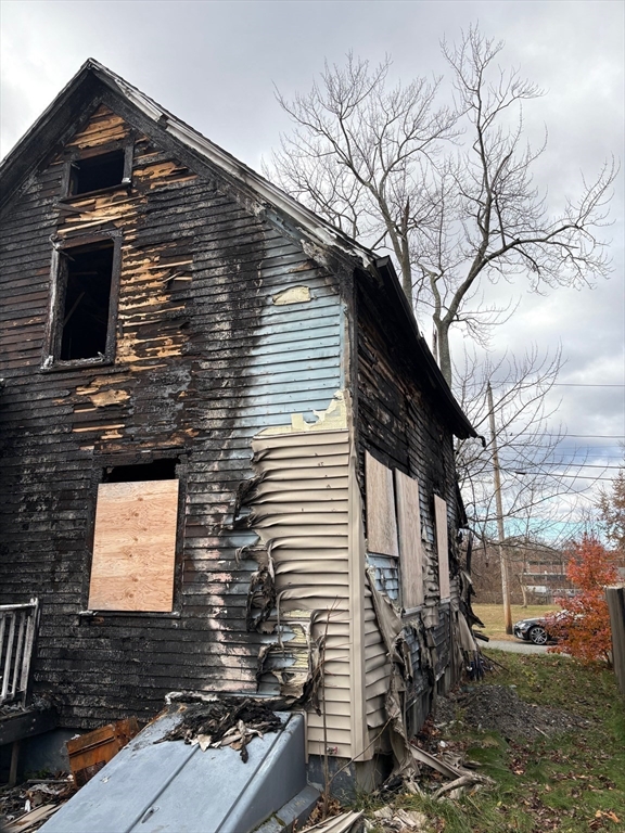 15 Hudson Avenue Chicopee, MA 01020 - Photo 7 of 7 a view of a brick house with a large tree