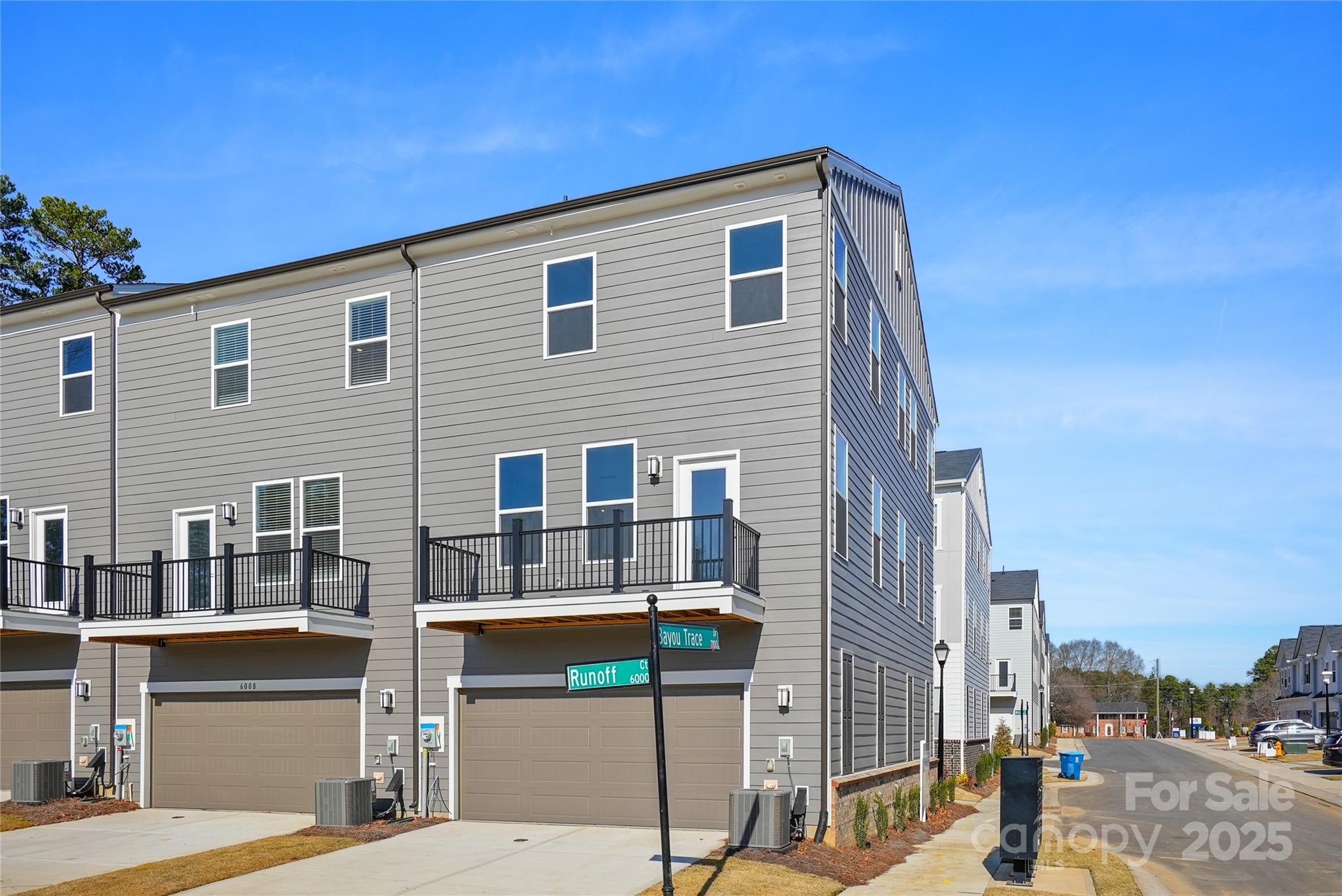 6004 Runoff Court Charlotte, NC 28262 - Photo 5 of 11 a front view of a building with street view
