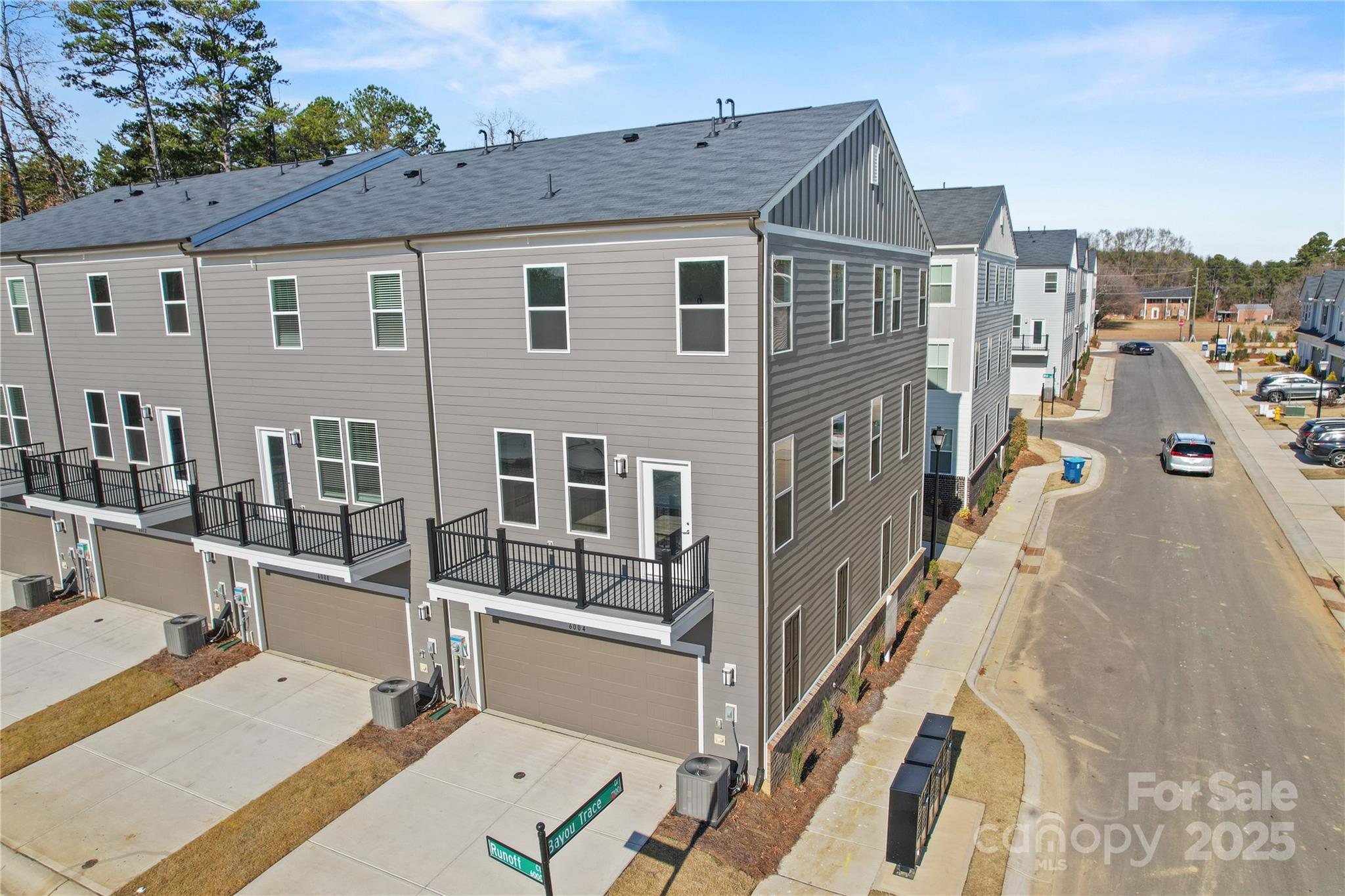 6004 Runoff Court Charlotte, NC 28262 - Photo 10 of 11 a view of a house with many windows
