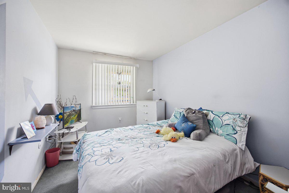 208 Timber Creek Road Lindenwold, NJ 08021 - Photo 10 of 12 a bedroom with a bed and window