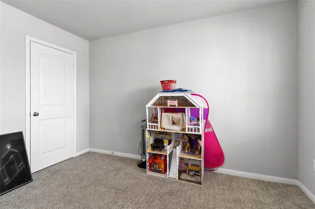 a view of a bedroom with a bed and utility room