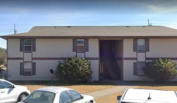 a car parked in front of a house