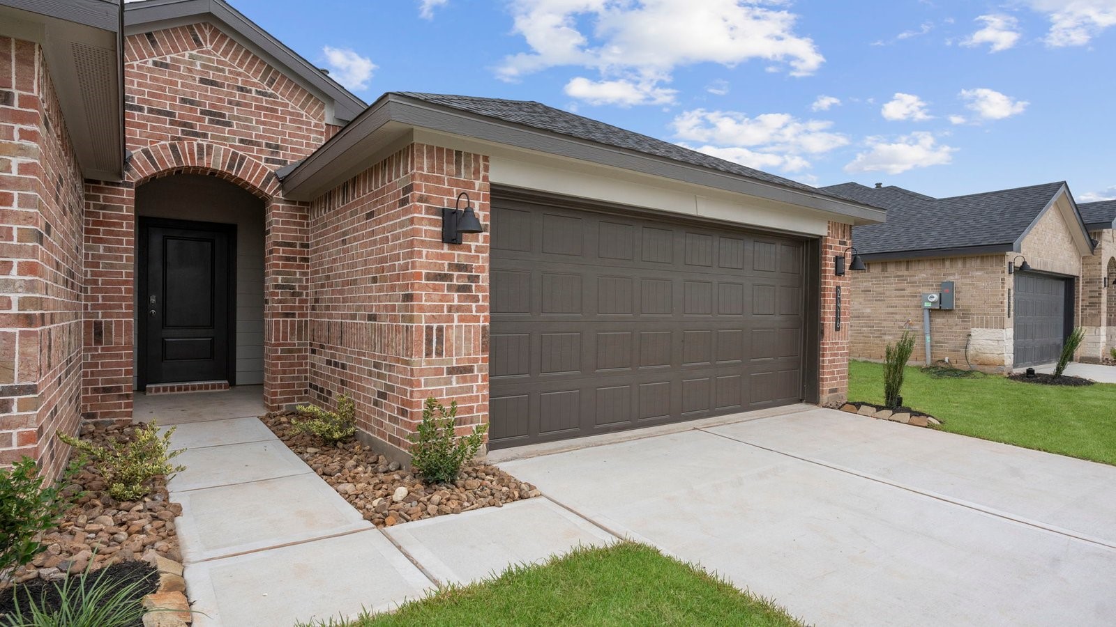13 Robin Court Angleton, TX 77515 - Photo 2 of 27 a front view of a house with a yard