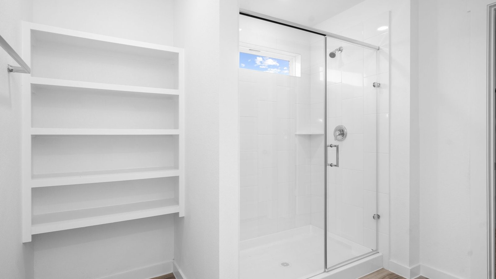 13 Robin Court Angleton, TX 77515 - Photo 21 of 27 a bathroom with a glass shower door