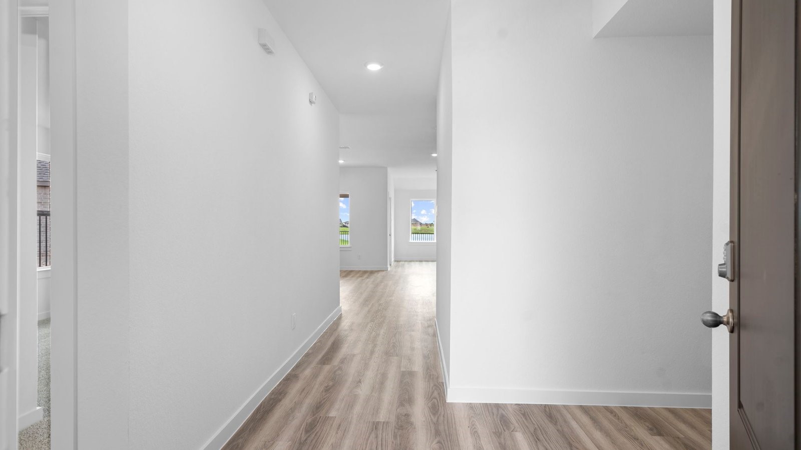 13 Robin Court Angleton, TX 77515 - Photo 3 of 27 a view of a hallway with wooden floor